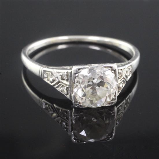 A 1920s/1930s platinum and single stone diamond ring with diamond set shoulders, size U.